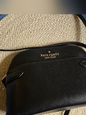 kate spade black dome crossbody with gold logo